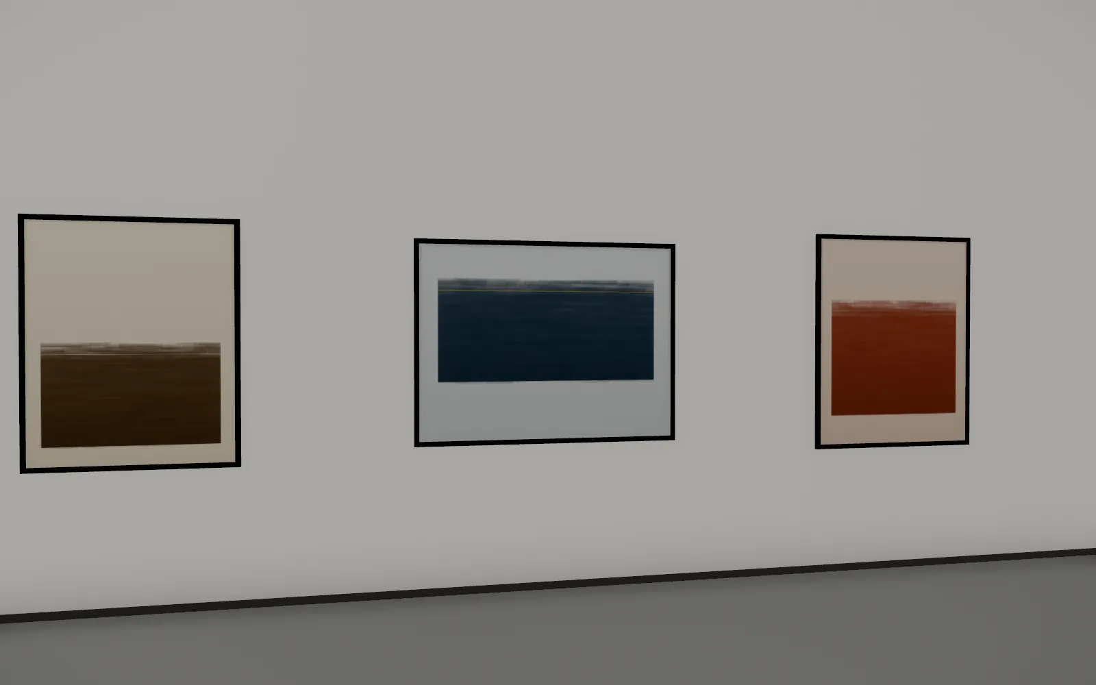 The three works, framed in black floaters.